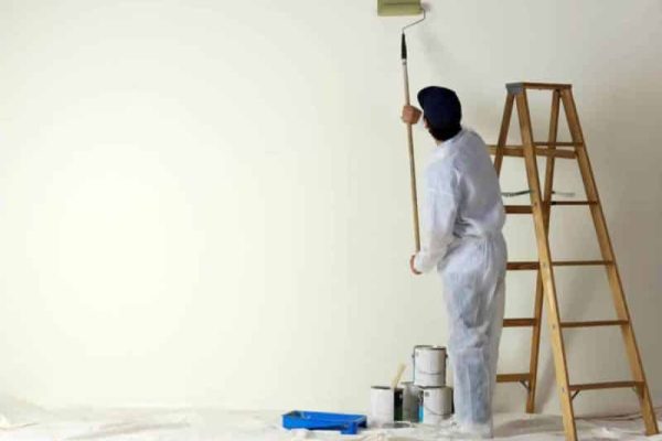 painting-contractor-painting-with-a-roller.jpg